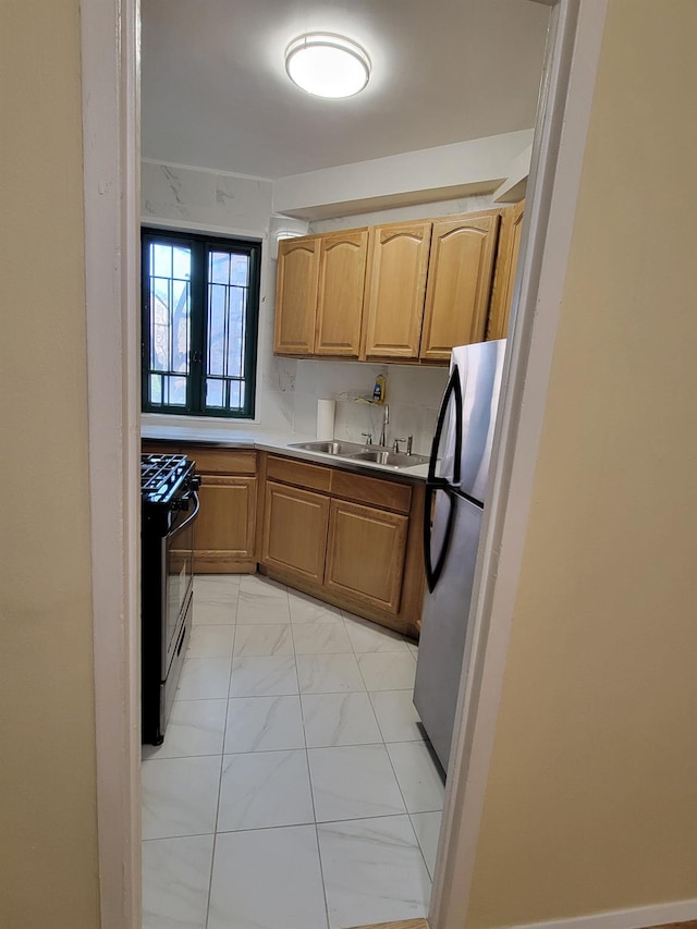 1503 Metropolitan Ave Unit 2F, Bronx, NY 10462 - kitchen featuring marble finish floor, light countertops, a sink, freestanding refrigerator, and range with gas stovetop