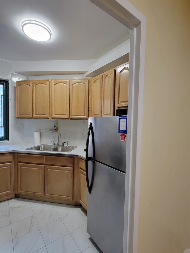 1503 Metropolitan Ave Unit 2F, Bronx, NY 10462 - kitchen with light countertops, freestanding refrigerator, a sink, and marble finish floor