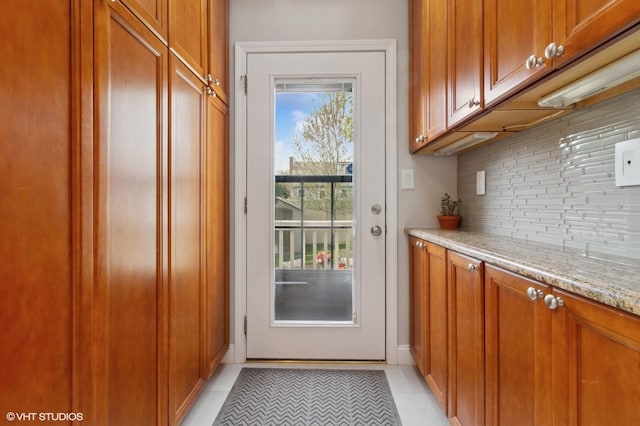 entryway with light tile patterned floors