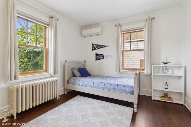 bedroom with crown molding, a wall mounted air conditioner, radiator, baseboards, and wood finished floors