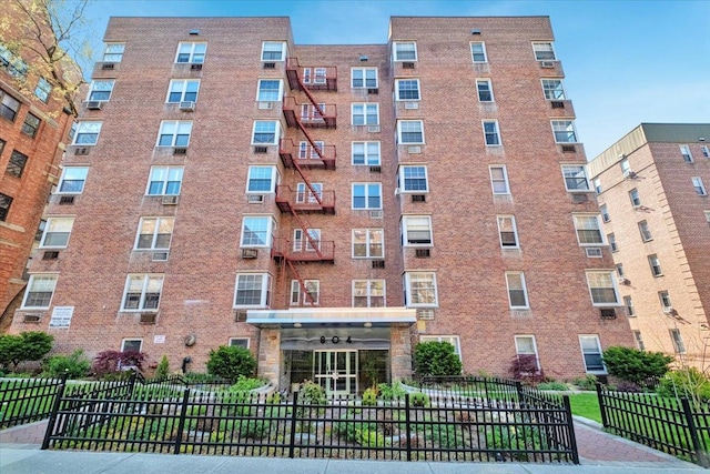 view of building exterior with fence