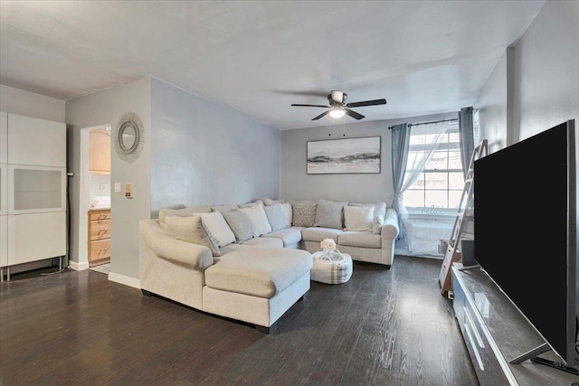 living room featuring ceiling fan and dark wood-style floors