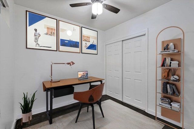 office with baseboards and ceiling fan