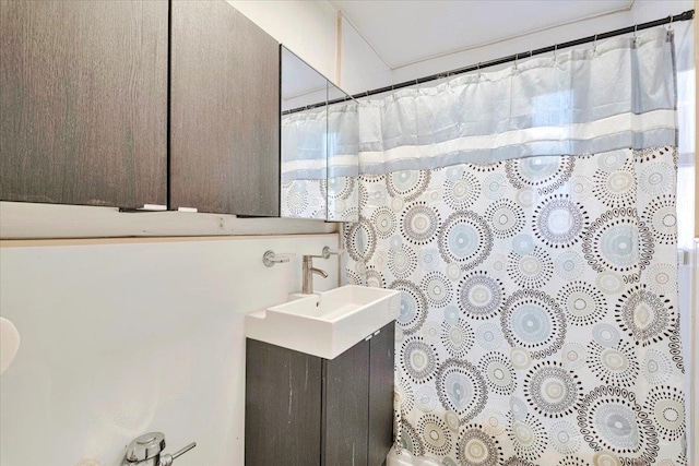 bathroom with vanity and a shower with shower curtain