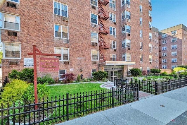 view of building exterior with fence