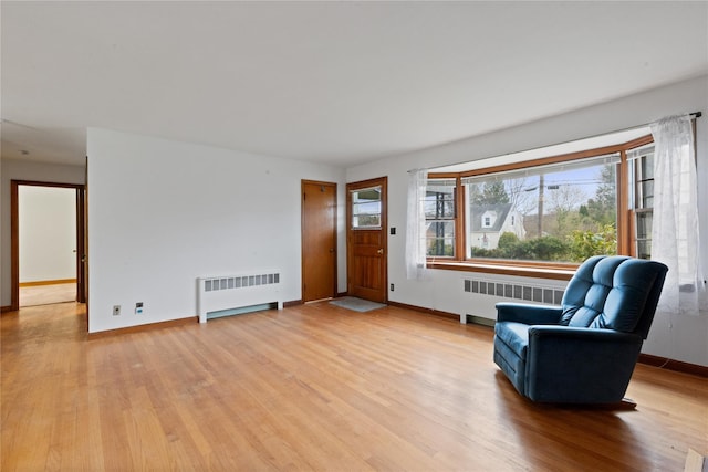 12 Brundage St, Armonk, NY 10504 - interior space with baseboards, radiator heating unit, and light wood finished floors