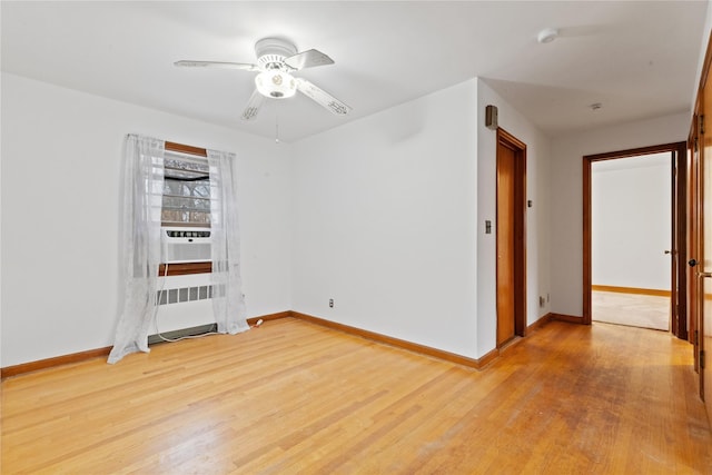 12 Brundage St, Armonk, NY 10504 - empty room with baseboards, ceiling fan, radiator heating unit, and light wood-style flooring