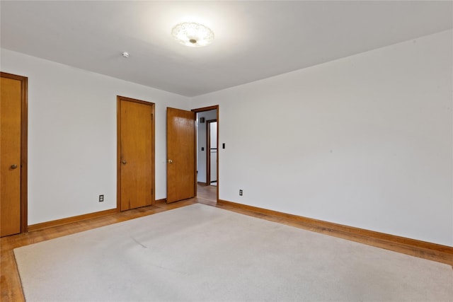 12 Brundage St, Armonk, NY 10504 - unfurnished bedroom with baseboards and light wood-style flooring