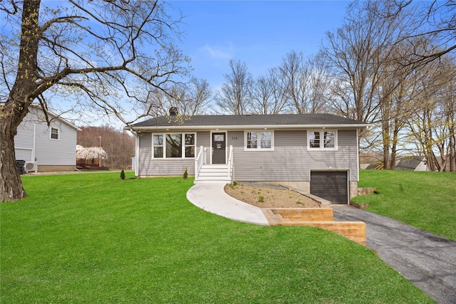 338 Rte 211 W, Middletown, NY 10940 - ranch-style home with a front yard, a chimney, a garage, and aphalt driveway