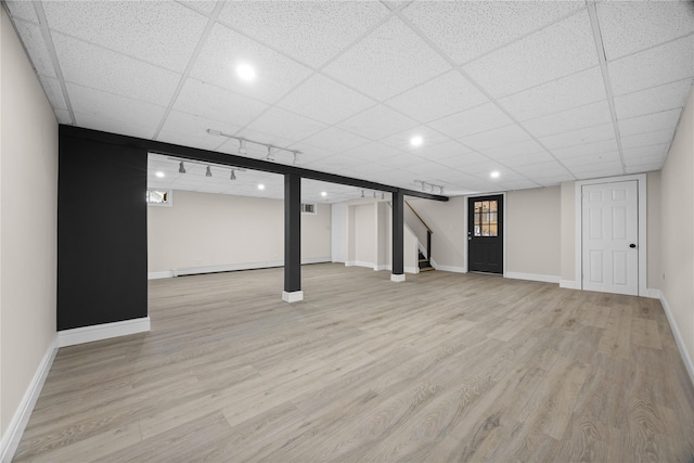 338 Rte 211 W, Middletown, NY 10940 - finished below grade area with stairway, a drop ceiling, wood finished floors, and baseboards