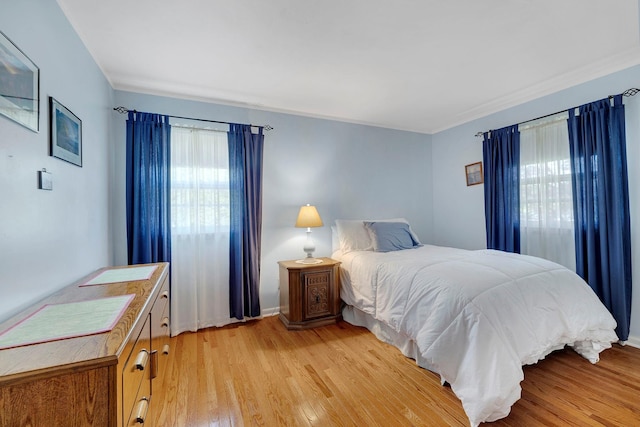 bedroom featuring light wood-type flooring