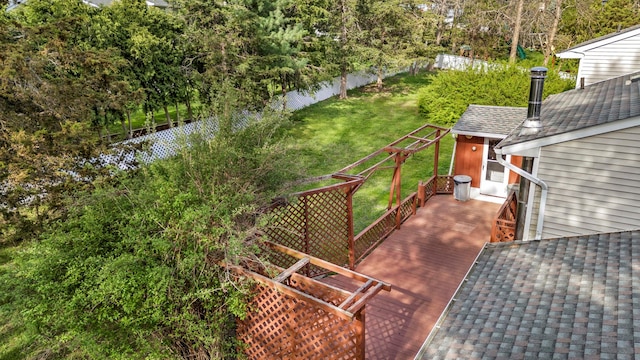 wooden terrace with a yard and a fenced backyard