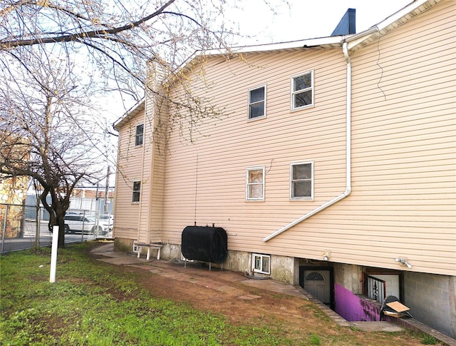 16739 147th Ave, Springfield Gardens, NY 11434 - back of property featuring a chimney and heating fuel