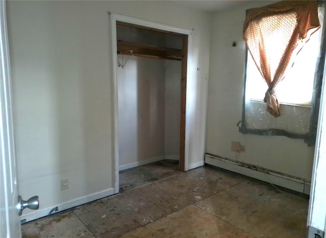 16739 147th Ave, Springfield Gardens, NY 11434 - unfurnished bedroom with a baseboard heating unit, baseboards, and a closet