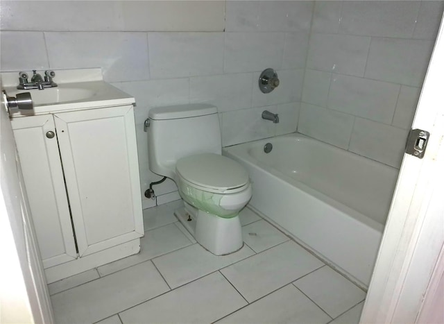 16739 147th Ave, Springfield Gardens, NY 11434 - bathroom featuring tile walls, toilet, vanity, and tile patterned floors