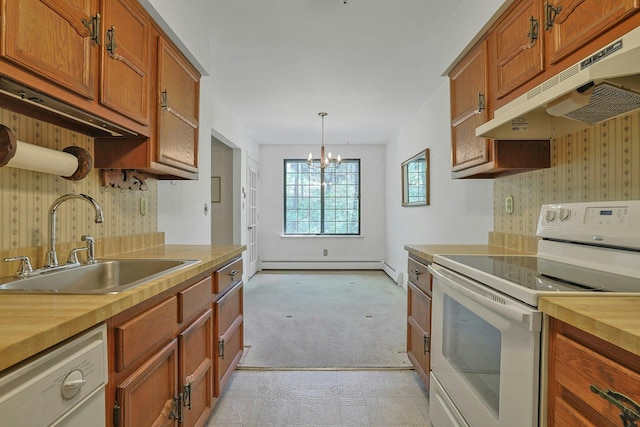 kitchen with a sink, baseboard heating, under cabinet range hood, butcher block counters, and white appliances