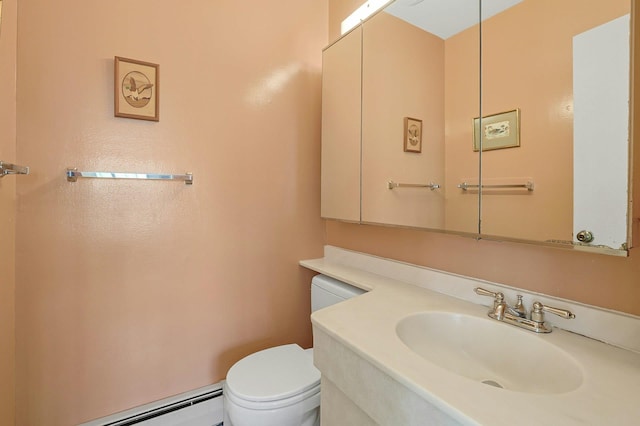 bathroom featuring a baseboard heating unit, toilet, and vanity