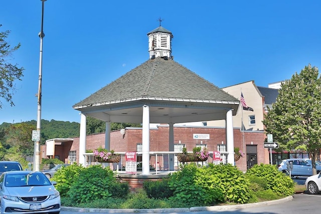 view of building exterior with parking