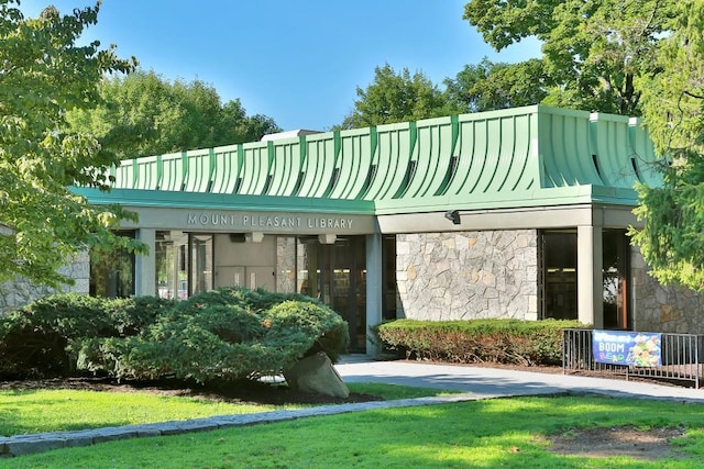 exterior space with stone siding