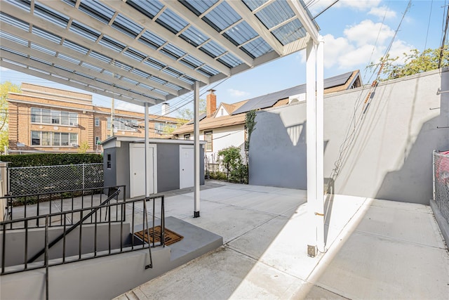 view of patio / terrace featuring fence