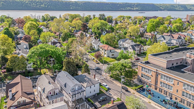 birds eye view of property featuring a residential view and a water view