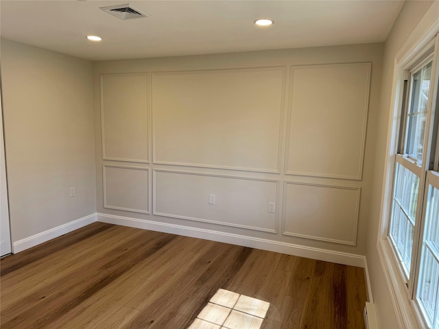 79 Enfield Ct Unit B, Ridge, NY 11961 - spare room featuring recessed lighting, wood finished floors, visible vents, and baseboards