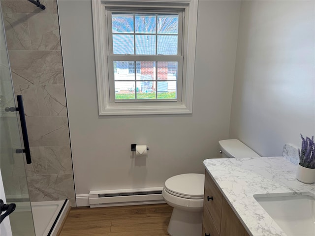 79 Enfield Ct Unit B, Ridge, NY 11961 - bathroom with a baseboard heating unit, a healthy amount of sunlight, vanity, and a stall shower