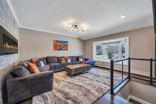 living room with crown molding, baseboards, a notable chandelier, and wood finished floors
