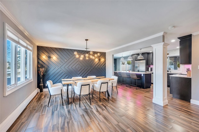 dining room with ornamental molding and a wealth of natural light