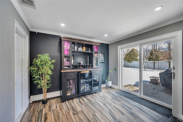 bar with a dry bar, recessed lighting, baseboards, wine cooler, and visible vents