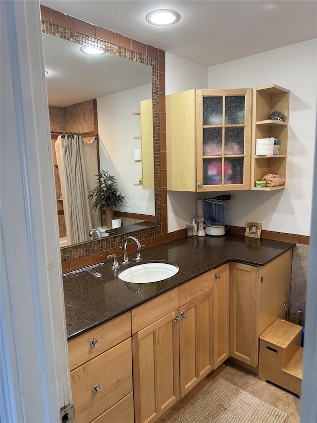 bathroom with vanity and tile patterned floors