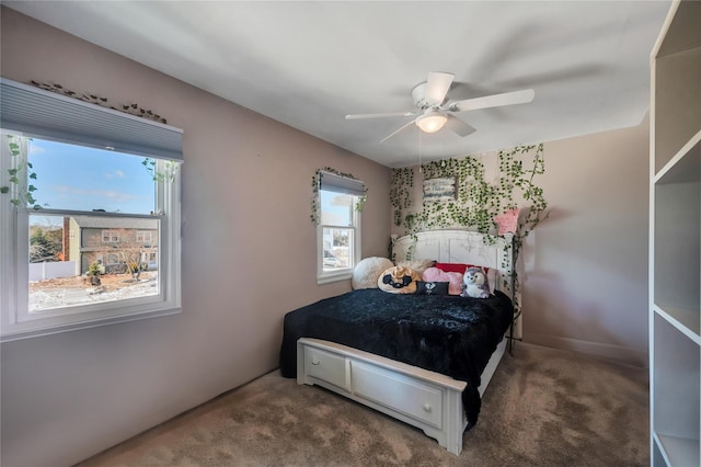 carpeted bedroom with a ceiling fan