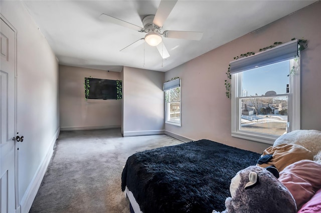 bedroom with baseboards and a ceiling fan