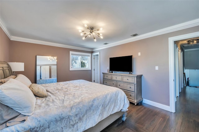 bedroom with ornamental molding, attic access, visible vents, and a chandelier
