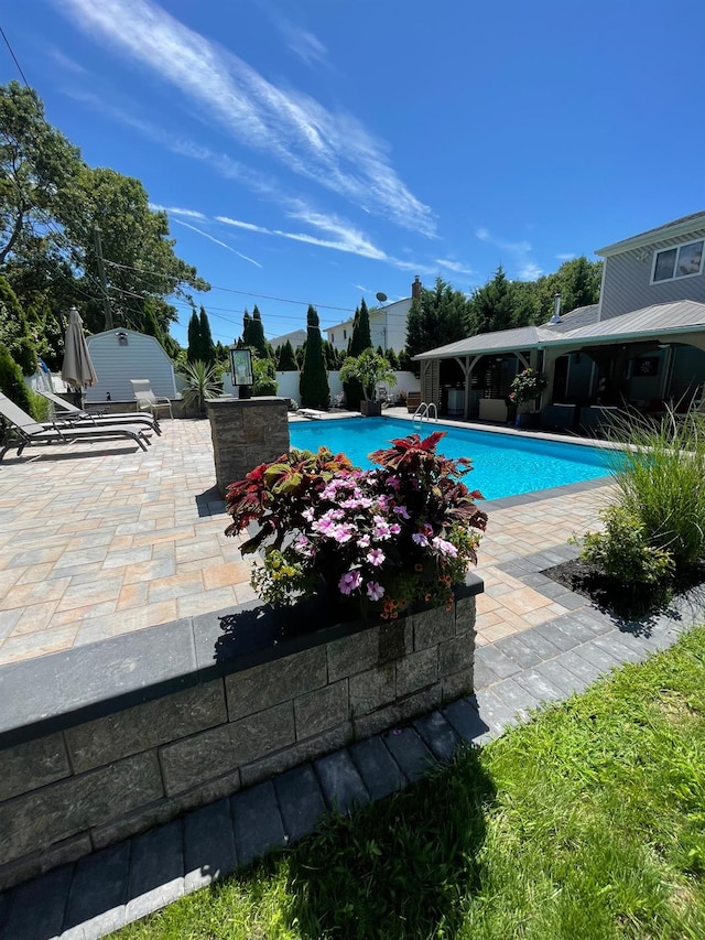 pool with a patio area