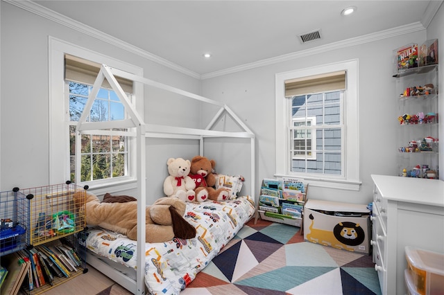 bedroom featuring visible vents, ornamental molding, wood finished floors, and recessed lighting