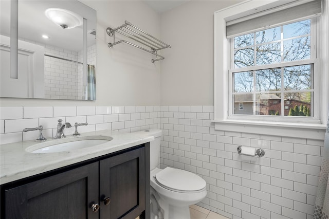 full bath featuring tile walls, tile patterned floors, vanity, toilet, and a shower with shower curtain
