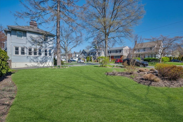view of yard featuring a residential view