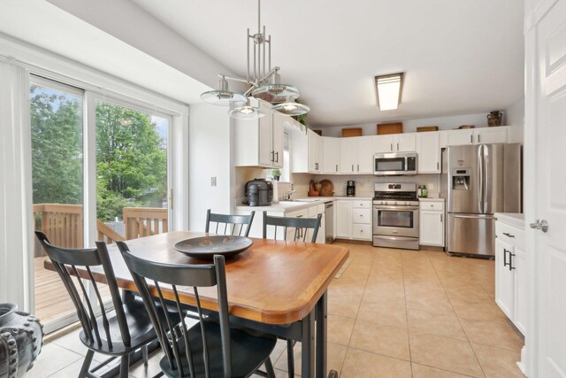 36 Alexander Dr, Washingtonville, NY 10992 - dining room with light tile patterned floors