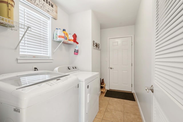 36 Alexander Dr, Washingtonville, NY 10992 - washroom featuring washing machine and dryer, light tile patterned floors, and plenty of natural light