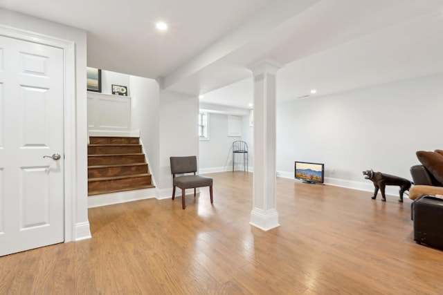 36 Alexander Dr, Washingtonville, NY 10992 - sitting room with stairway, light wood finished floors, decorative columns, recessed lighting, and baseboards
