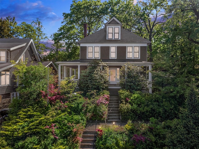 101 Mohican Park Ave, Dobbs Ferry, NY 10522 - american foursquare style home with stairs, covered porch, a chimney, and roof with shingles