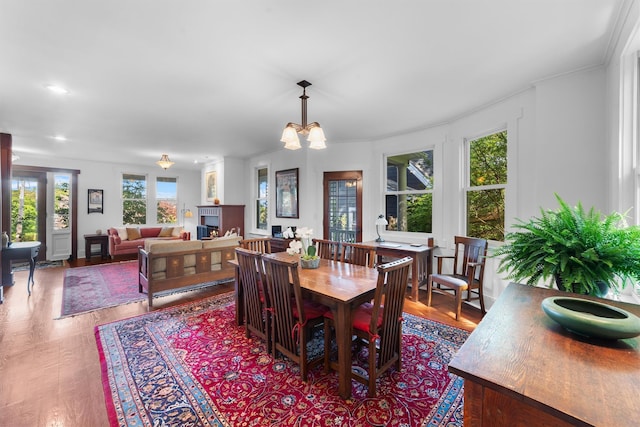 101 Mohican Park Ave, Dobbs Ferry, NY 10522 - dining room with wood finished floors, a chandelier, and ornamental molding
