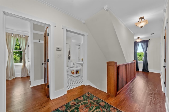 101 Mohican Park Ave, Dobbs Ferry, NY 10522 - hallway featuring crown molding, wood finished floors, an upstairs landing, and baseboards