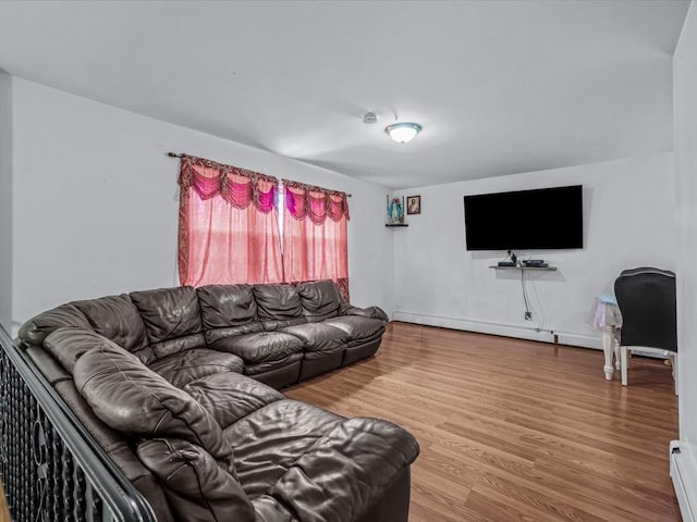 living room featuring wood finished floors and a baseboard radiator