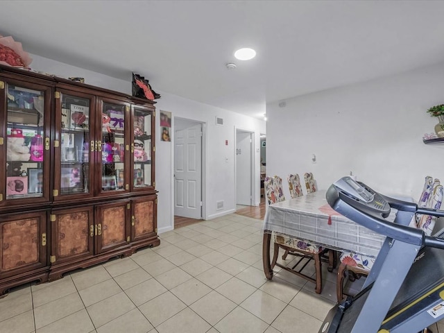 interior space featuring light tile patterned flooring and visible vents