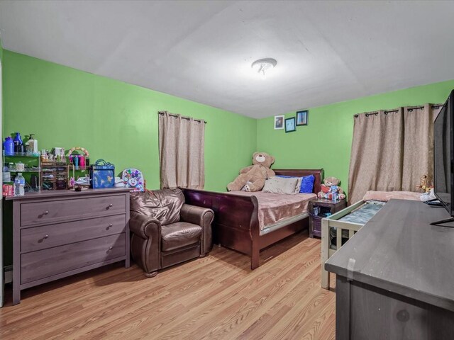 bedroom featuring light wood-style flooring
