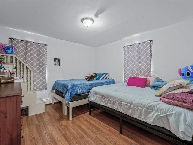 bedroom with wood finished floors