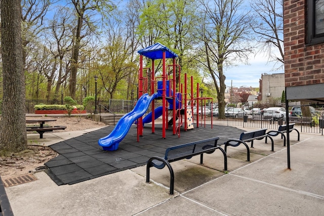 community jungle gym featuring fence