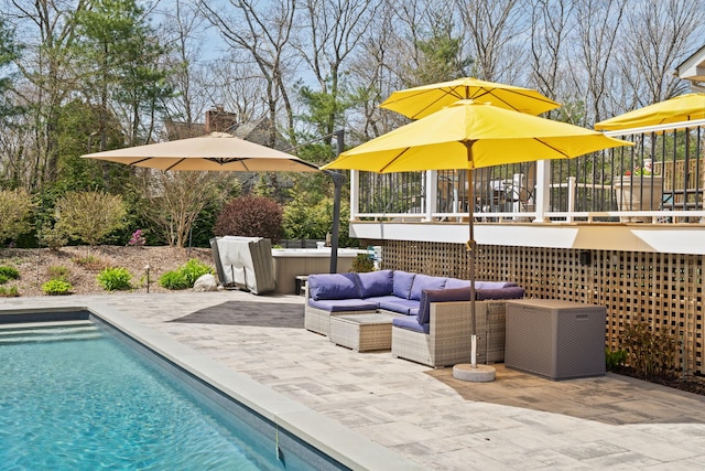 outdoor pool featuring an outdoor hangout area, a patio area, and a deck